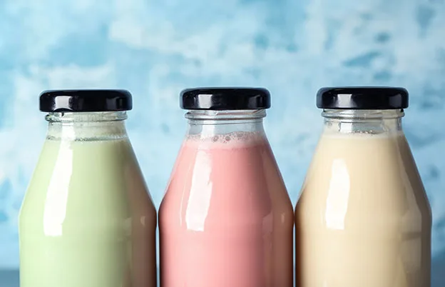 colored milk in glass jars