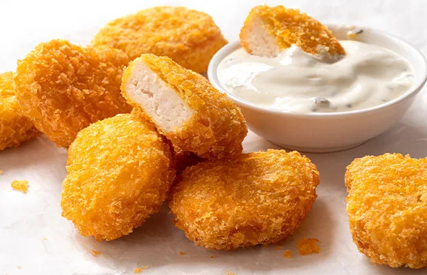 chicken nuggets and white dipping sauce