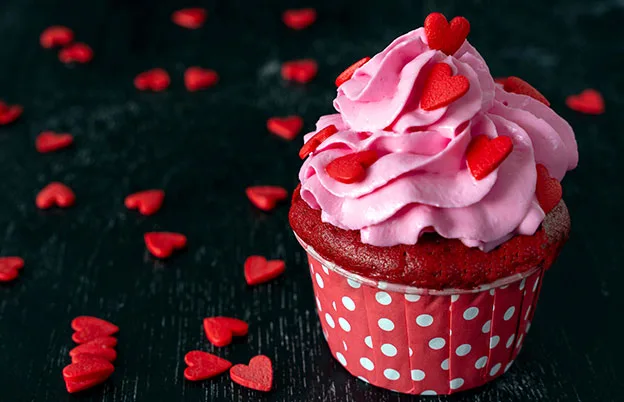 pink cupcake with heart sprinkles